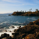 The view of homes from the rocks at Pike Point in East Sooke Park.